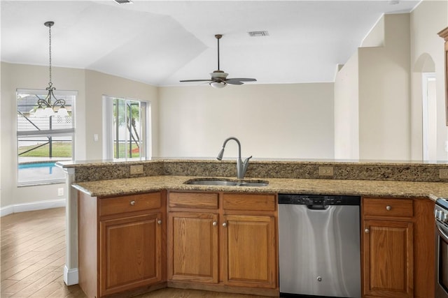 kitchen with sink, vaulted ceiling, stainless steel dishwasher, ceiling fan, and light hardwood / wood-style flooring