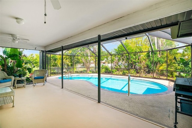 outdoor pool featuring a ceiling fan, a lanai, and a patio area