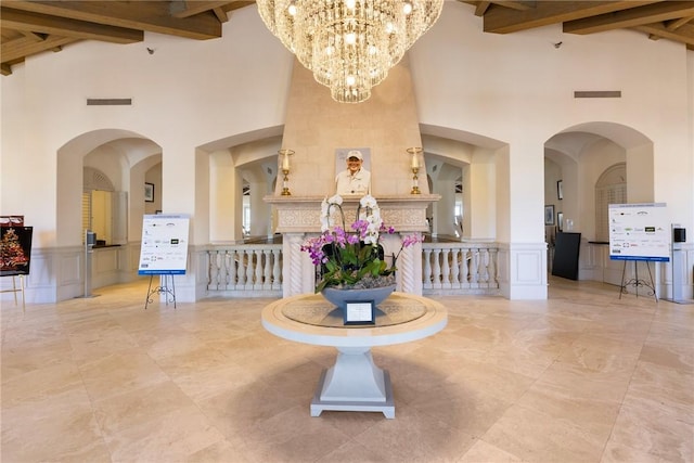 5520 N Harbor Village Dr Unit 204, Vero Beach, FL 32967 - lobby featuring a towering ceiling, beam ceiling, and a decorative wall
