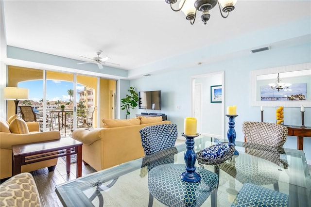 5520 N Harbor Village Dr Unit 204, Vero Beach, FL 32967 - living room featuring a chandelier and a ceiling fan