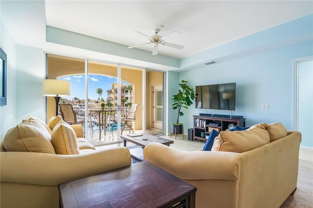 5520 N Harbor Village Dr Unit 204, Vero Beach, FL 32967 - living area featuring a ceiling fan and baseboards