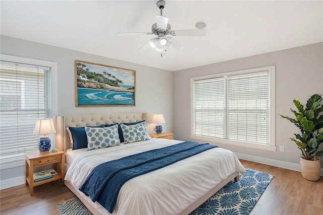 5440 95th St, Sebastian, FL 32958 - bedroom featuring multiple windows, wood finished floors, and a ceiling fan