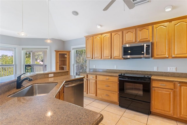 5440 95th St, Sebastian, FL 32958 - kitchen featuring appliances with stainless steel finishes, pendant lighting, light tile patterned flooring, a ceiling fan, and stone countertops