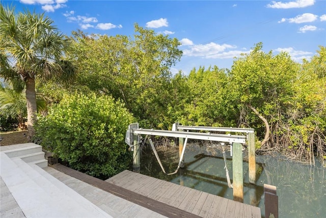 5440 95th St, Sebastian, FL 32958 - dock area with a water view and boat lift