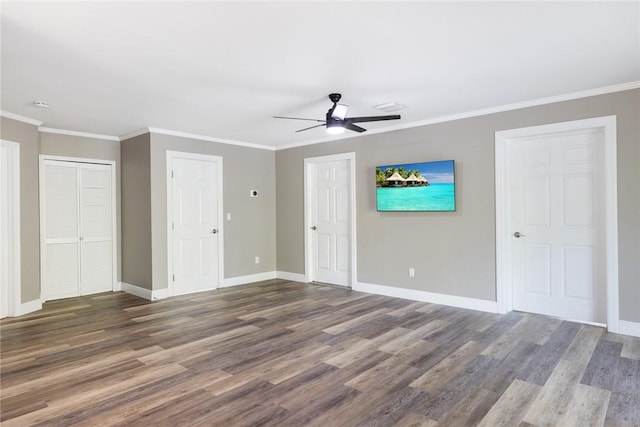 5440 95th St, Sebastian, FL 32958 - unfurnished bedroom featuring wood finished floors, ornamental molding, and a ceiling fan