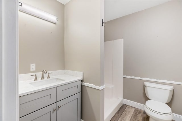 5440 95th St, Sebastian, FL 32958 - full bathroom featuring vanity, a shower, and wood finished floors