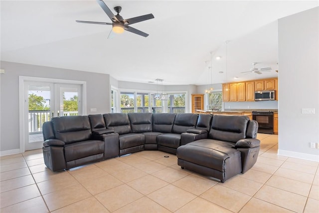 5440 95th St, Sebastian, FL 32958 - living room featuring lofted ceiling, a ceiling fan, light tile patterned floors, and plenty of natural light