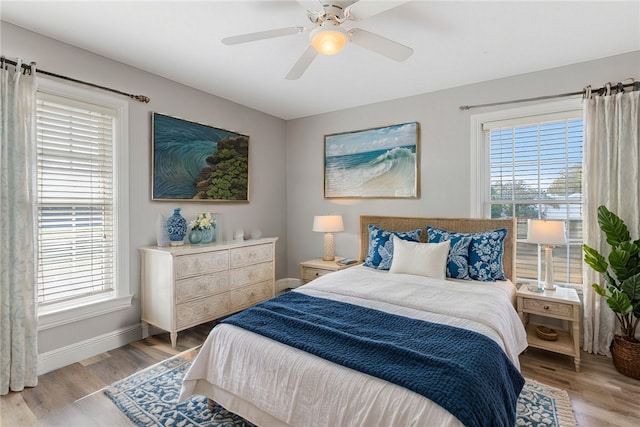 5440 95th St, Sebastian, FL 32958 - bedroom featuring multiple windows and light wood-type flooring