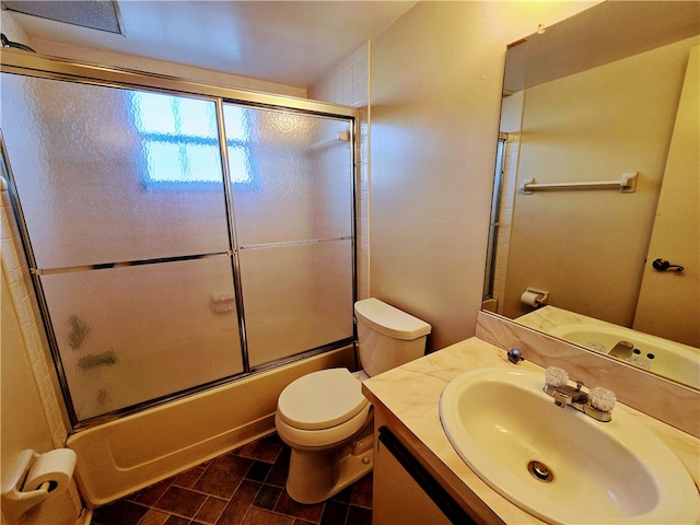 full bathroom with toilet, vanity, and shower / bath combination with glass door