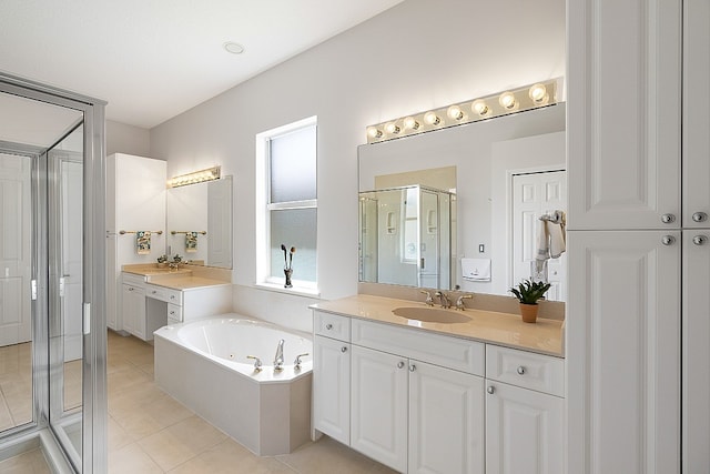 bathroom featuring vanity, tile patterned floors, and plus walk in shower