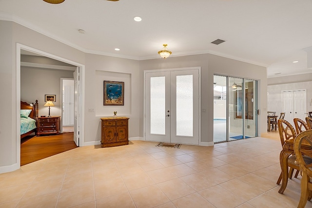 doorway to outside featuring ornamental molding, french doors, and light hardwood / wood-style floors