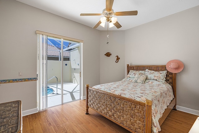 bedroom with ceiling fan, hardwood / wood-style flooring, and access to exterior