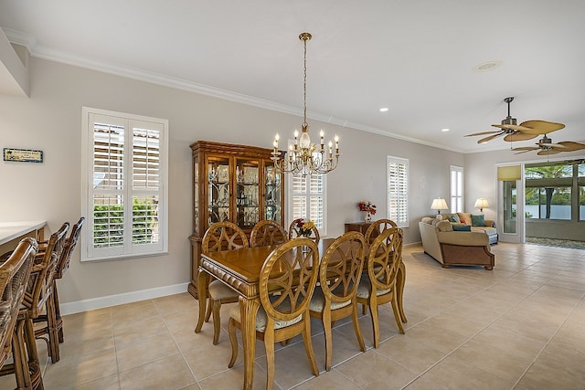 tiled dining room with ceiling fan with notable chandelier and crown molding