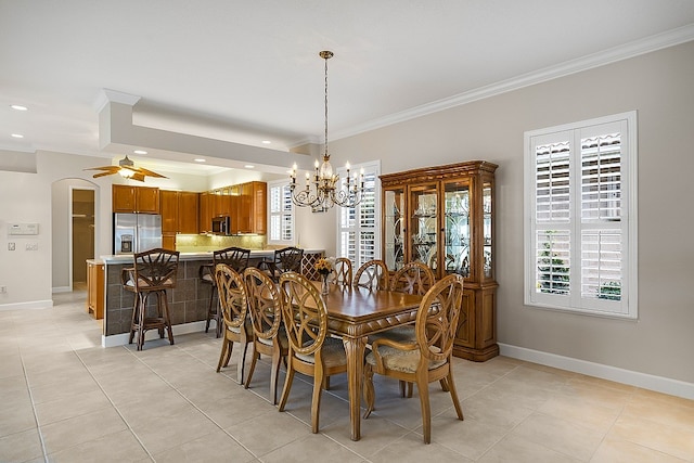 dining room featuring ornamental molding, ceiling fan with notable chandelier, and light tile patterned flooring