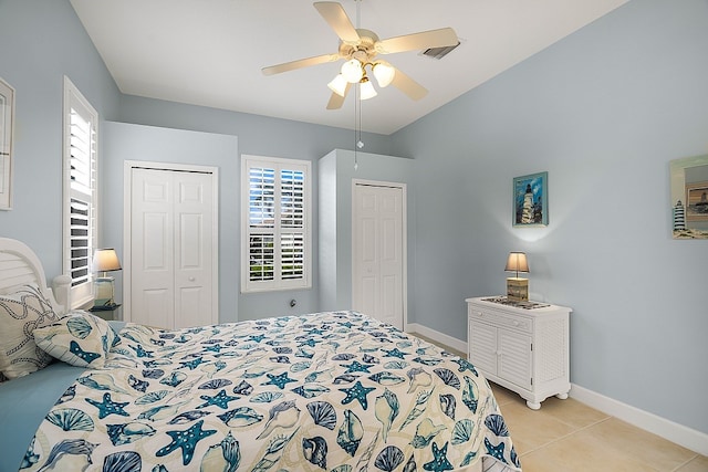 bedroom featuring light tile patterned flooring and ceiling fan