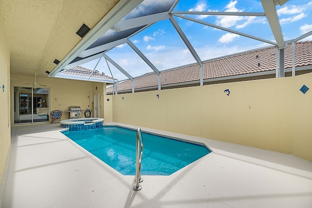 view of swimming pool with an in ground hot tub, a patio, a grill, a lanai, and ceiling fan