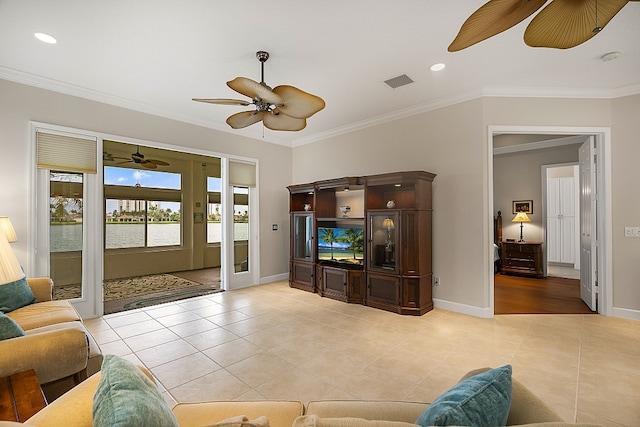 living room featuring ceiling fan, light tile patterned floors, and crown molding