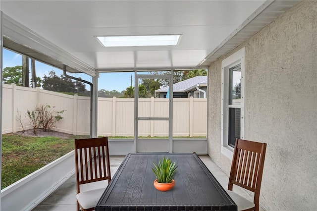 sunroom / solarium with a wealth of natural light and a skylight