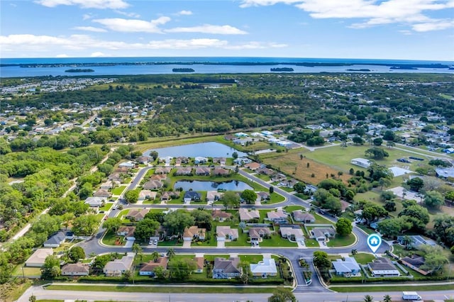 birds eye view of property featuring a water view