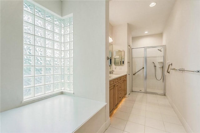 bathroom with vanity, tile patterned flooring, and a shower with door