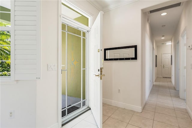 hall featuring light tile patterned floors