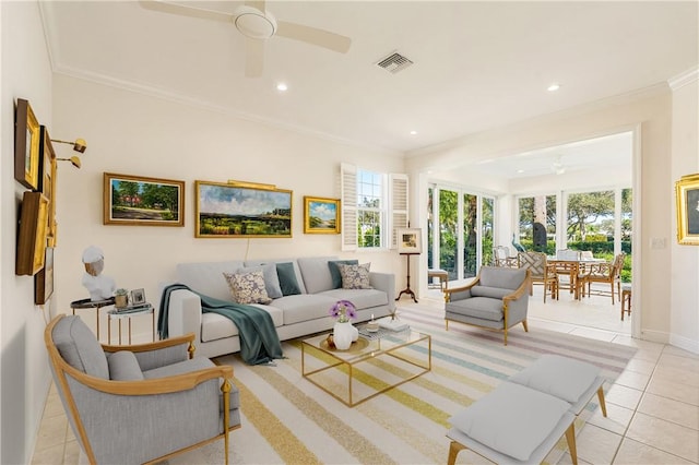 living room with light tile patterned floors, ornamental molding, and ceiling fan