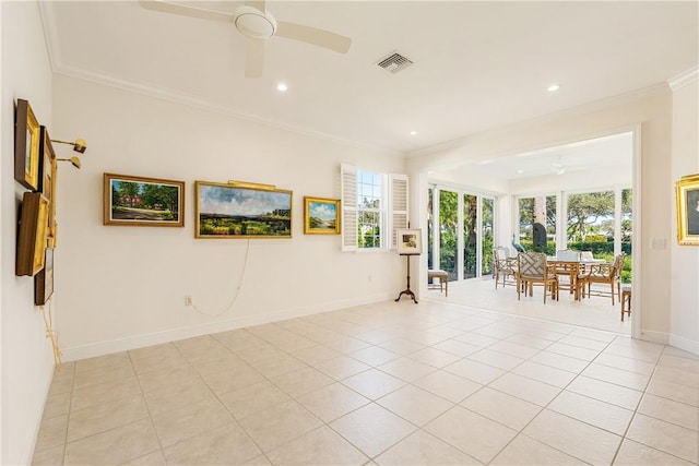 unfurnished room with ceiling fan, ornamental molding, and light tile patterned floors