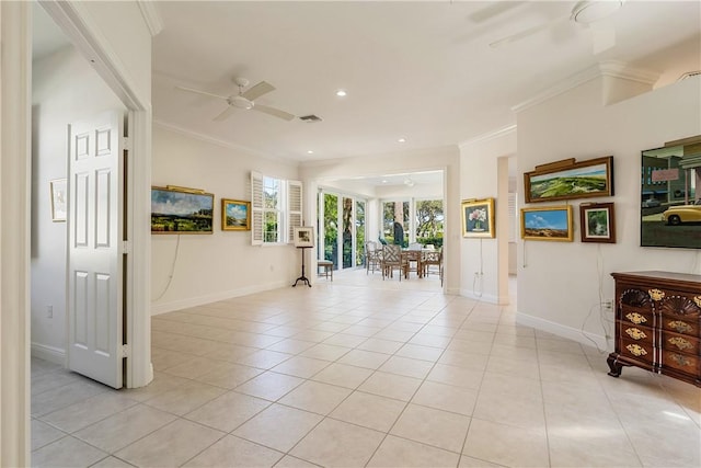 tiled empty room featuring crown molding and ceiling fan