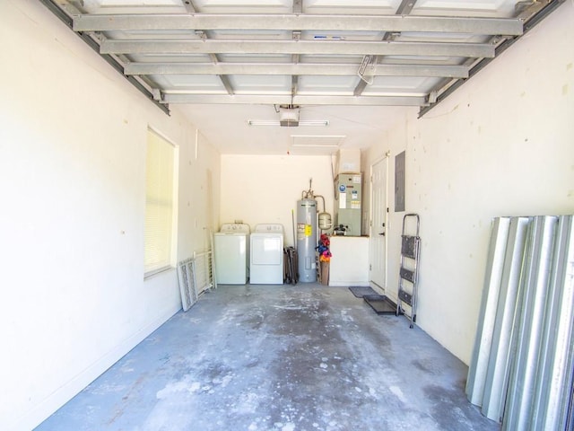 garage featuring water heater, a garage door opener, electric panel, and separate washer and dryer