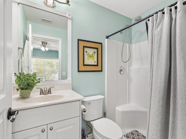 full bath with vanity, a shower with shower curtain, visible vents, a textured ceiling, and toilet