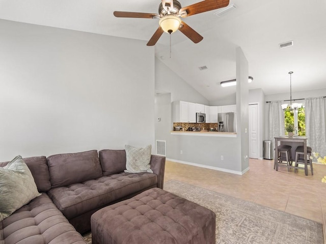 living room with light tile patterned floors, ceiling fan with notable chandelier, and visible vents