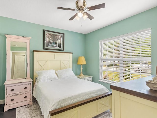 bedroom featuring wood finished floors and ceiling fan