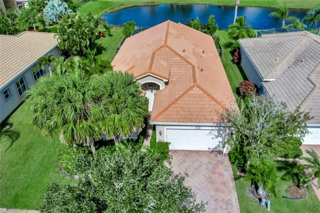 birds eye view of property with a water view