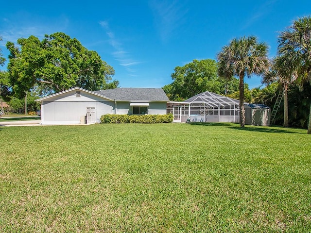 view of front of home with a front lawn, a lanai, and stucco siding