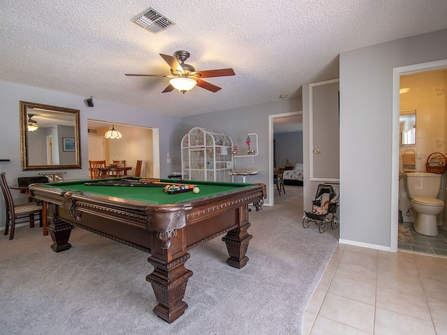 game room featuring light colored carpet, light tile patterned floors, ceiling fan, visible vents, and billiards