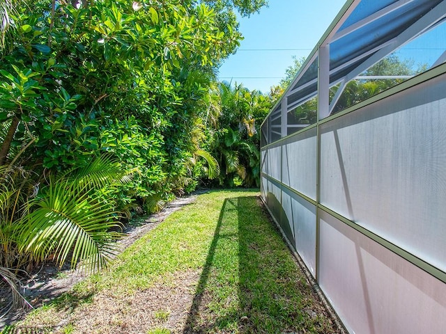 view of yard with a lanai