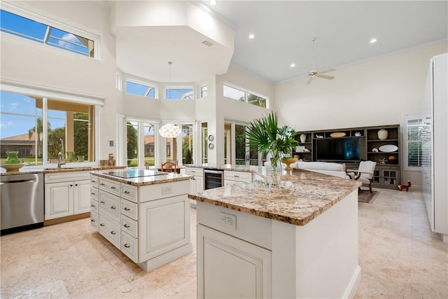 kitchen featuring stainless steel dishwasher, beverage cooler, light stone countertops, and a kitchen island