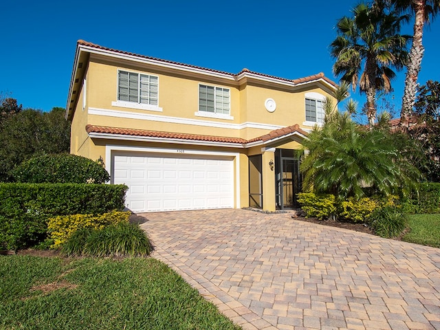 mediterranean / spanish-style house featuring a garage