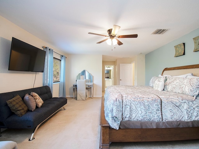 bedroom featuring light carpet and ceiling fan