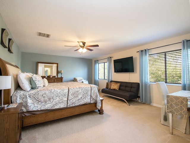 carpeted bedroom with ceiling fan