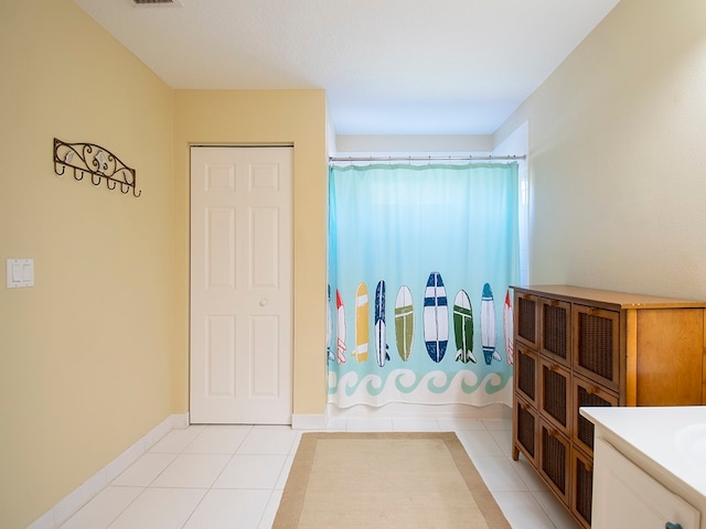 bathroom with vanity and tile patterned flooring