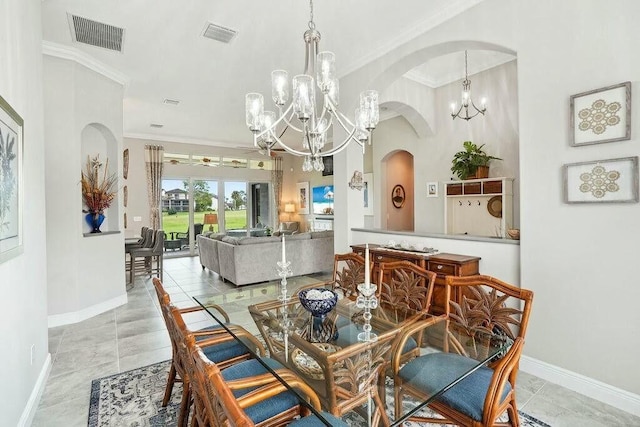 dining space with a chandelier, visible vents, ornamental molding, and baseboards