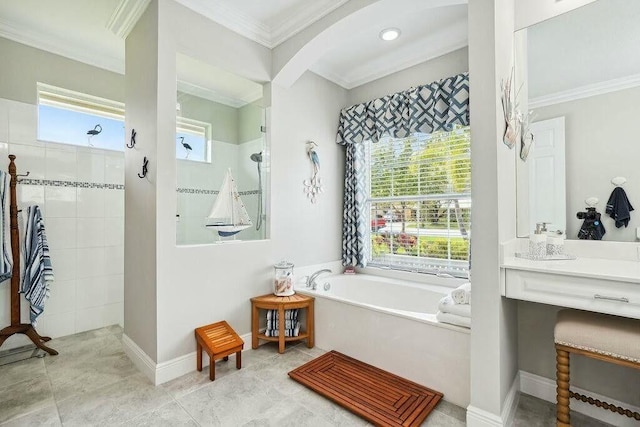 bathroom featuring a garden tub, ornamental molding, walk in shower, and baseboards