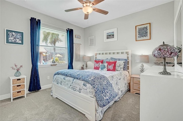 bedroom with ceiling fan, carpet floors, and baseboards