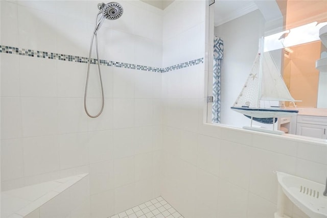 full bathroom featuring crown molding and tiled shower