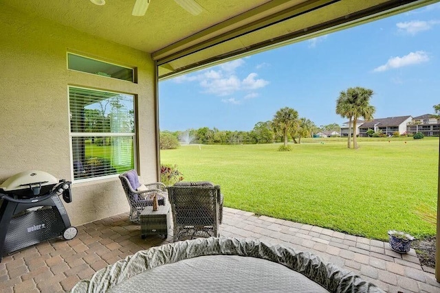 view of patio / terrace featuring a grill and ceiling fan