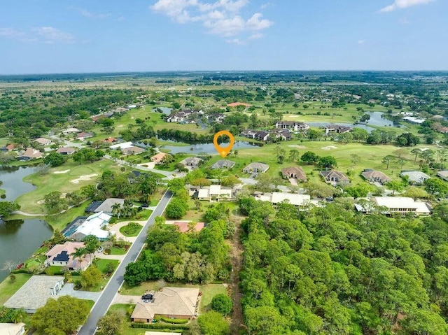 drone / aerial view featuring a water view and a residential view