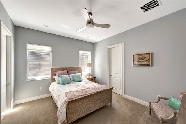 bedroom with ceiling fan and carpet floors