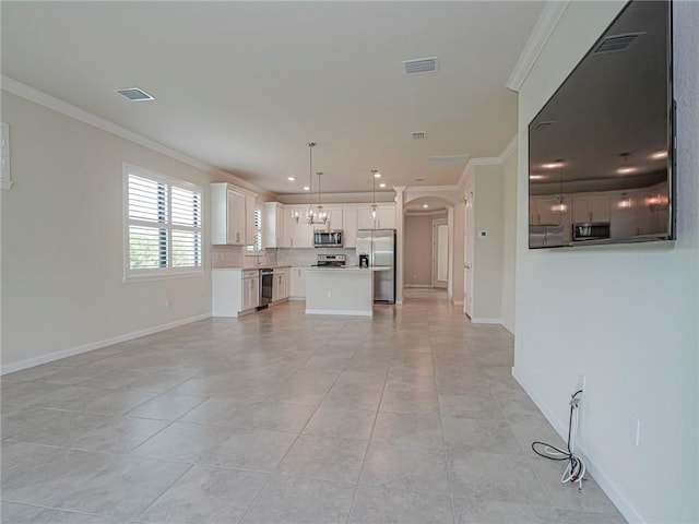 5190 Unity Sq, Vero Beach, FL 32967 - unfurnished living room featuring ornamental molding, arched walkways, light tile patterned floors, a chandelier, and recessed lighting