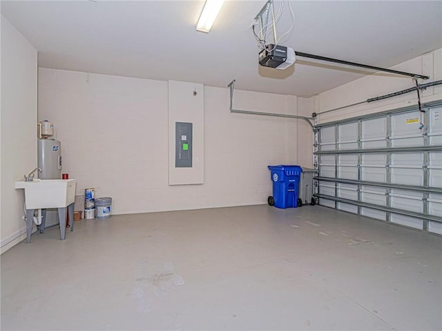5190 Unity Sq, Vero Beach, FL 32967 - garage with electric panel, a garage door opener, concrete block wall, and water heater